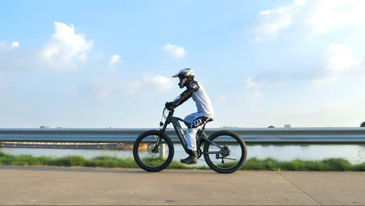 Person riding Shengmilo electric bicycle on a clear day to explore Europe's popular electric bicycles-Shengmilo S600