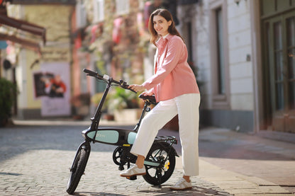 Woman standing with DYU C2 16 Inch Full Folding Electric Bike with 250W Mottor and 48V7.5AH Battery on cobblestone street