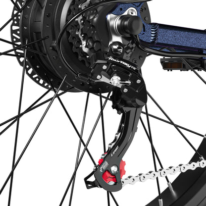 Close-up of the rear derailleur and chain on the Shengmilo MX03 electric bike showing detailed gear mechanism